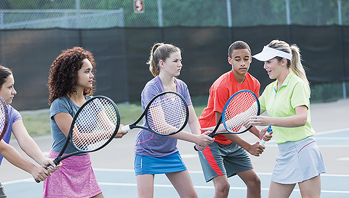 teenagers at tennis clinic