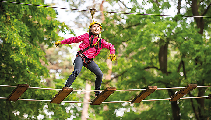 feriencamp - artworks depict games at eco resort which includes flying fox or spider net. children summer activities. happy little child climbing a tree.