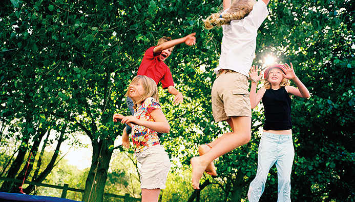 4 children leaping on trampoline